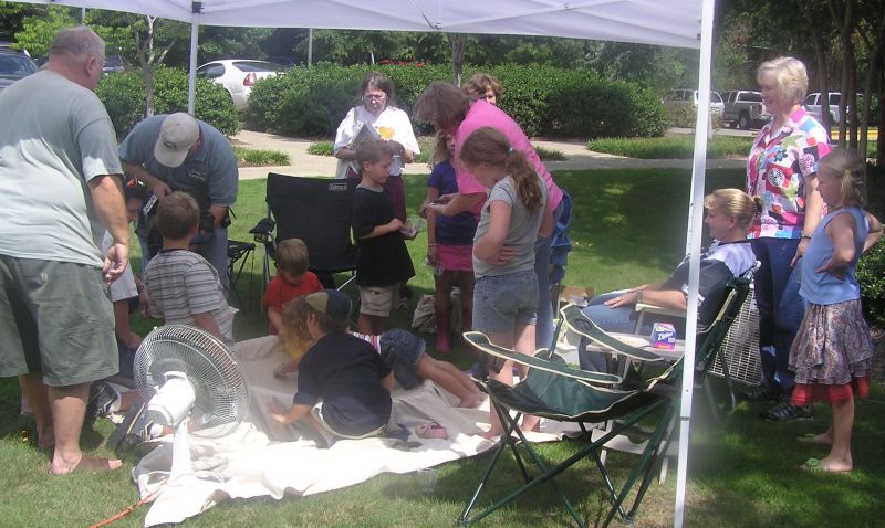 kids finding fossils in sand pile