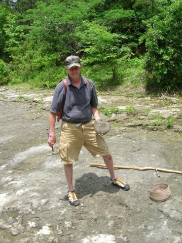 bobby holding fossil ammonite